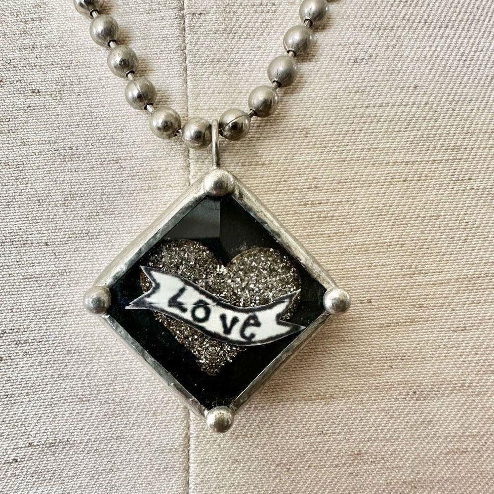 Silver tone love pendant necklace
